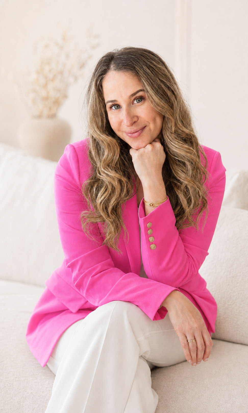 Natalie Smotkin wearing a vivid pink blazer